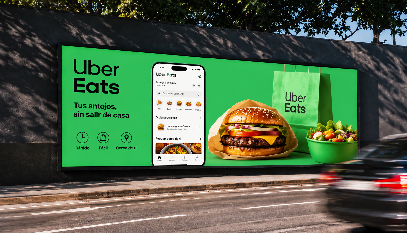 Valla publicitaria digital horizontal DOOH de Elevision Group junto a una avenida con una campaña de Uber Eats.